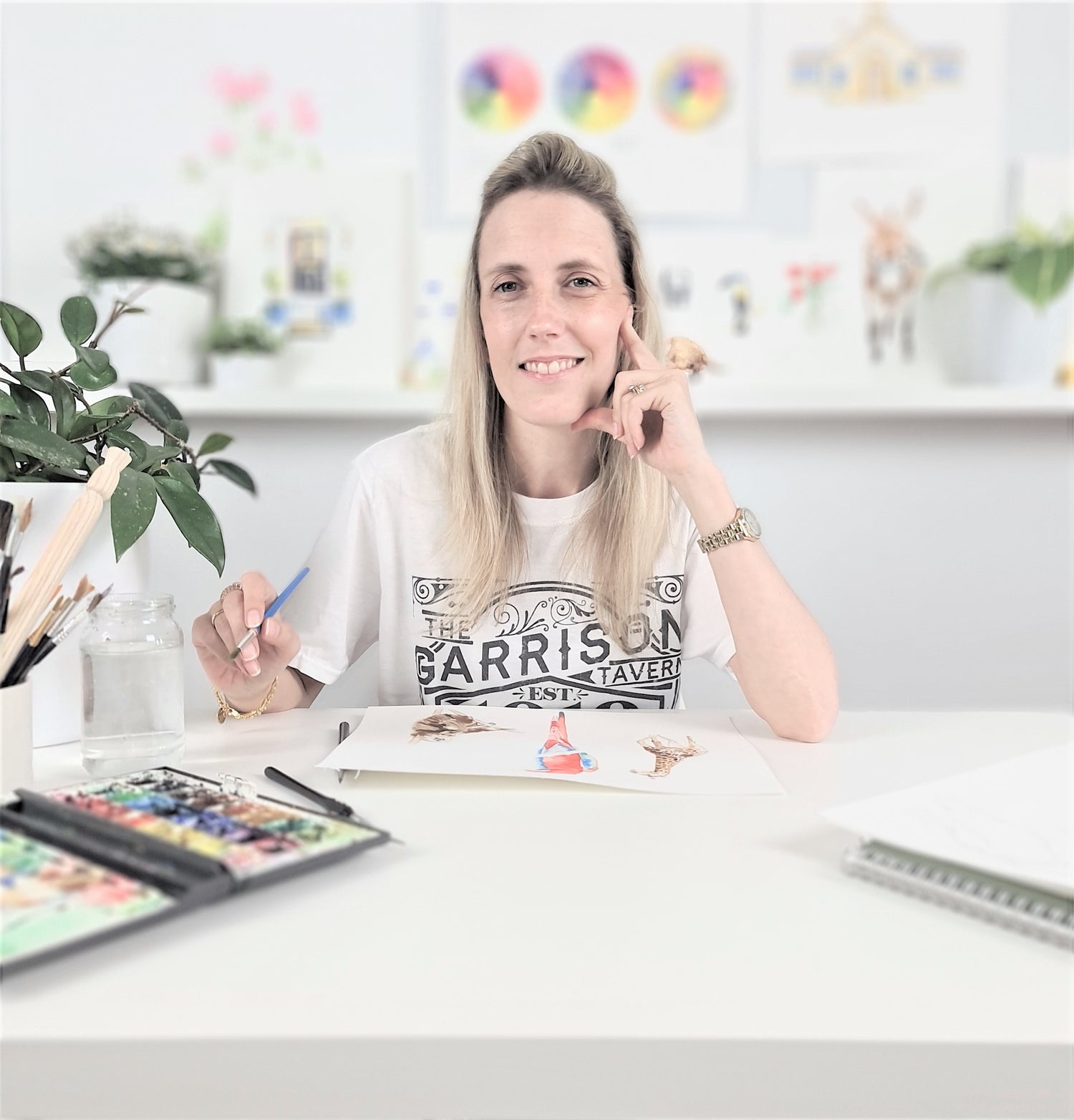 Artist Annie Grant painting in her studio